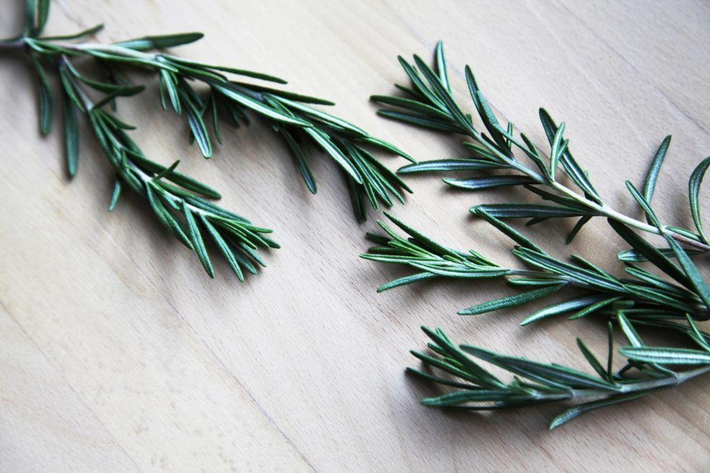 An herb laying on a wooden surface