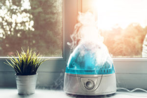 The white humidifier moistens dry air. Improving the comfort of living in the home, apartment. Improving the well-being of people.