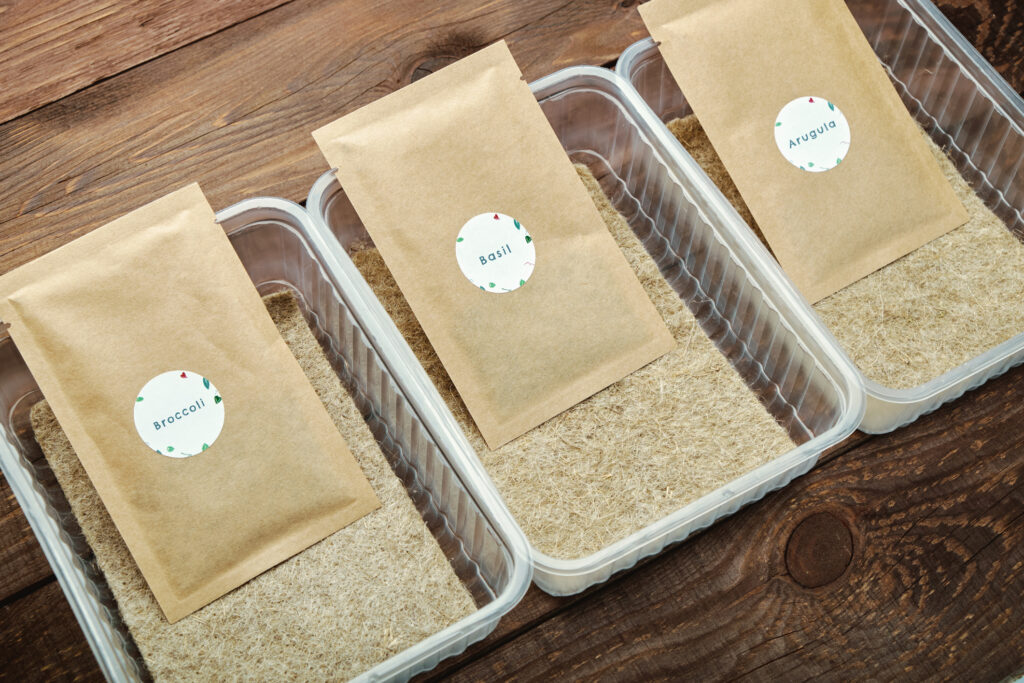 Microgreen planting kits. Packs of seeds, plastic containers and linen mats.