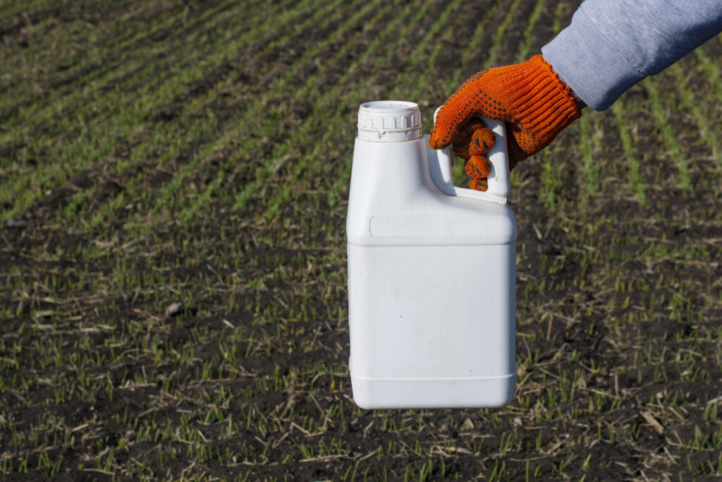 Protection of crops from diseases. Bottle with fungicide.